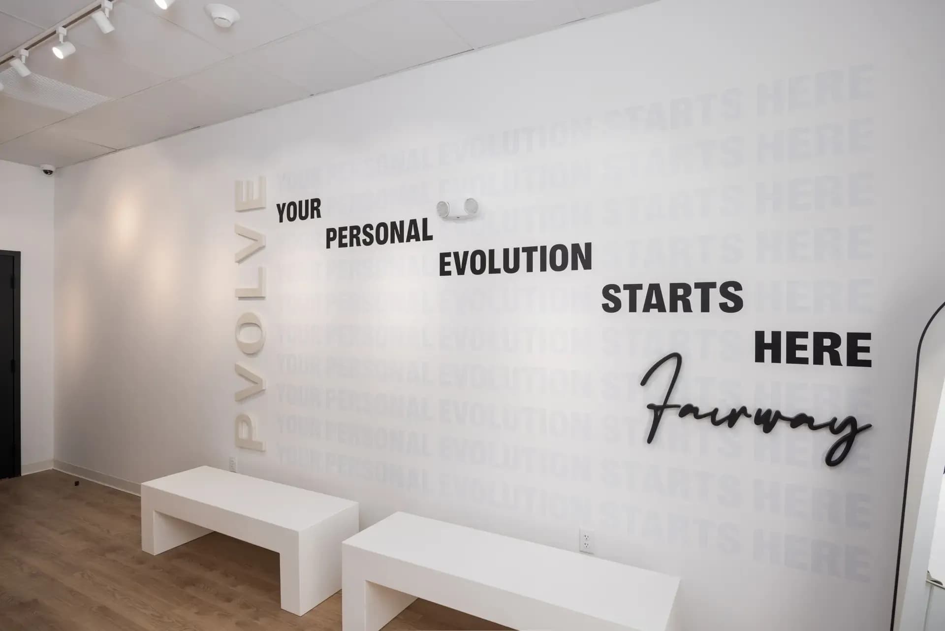 Inspirational message displayed on a wall inside a Pvolve studio