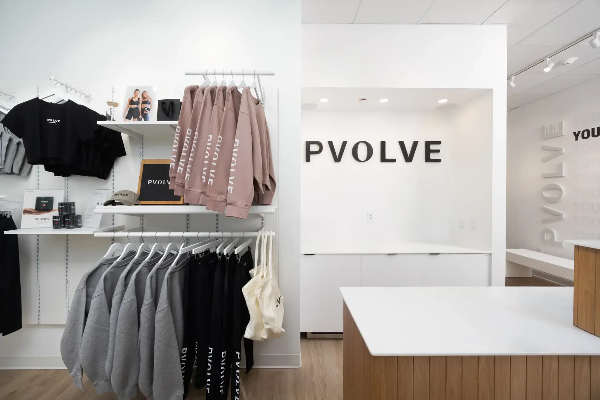 Pvolve studio retail display with branded apparel and merchandise