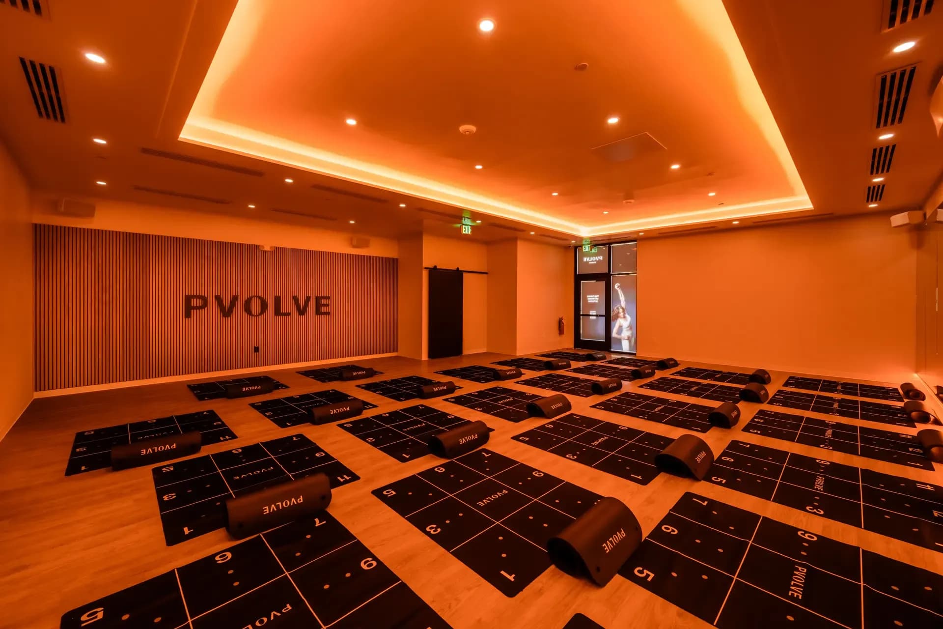Empty PVOLVE studio with orange mood lighting